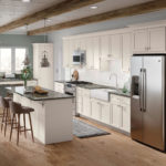 White Shaker Kitchen Cabinets with Island and Built-in Desk - Omni Cabinet Door Style with Snow Finish By Mantra Cabinets